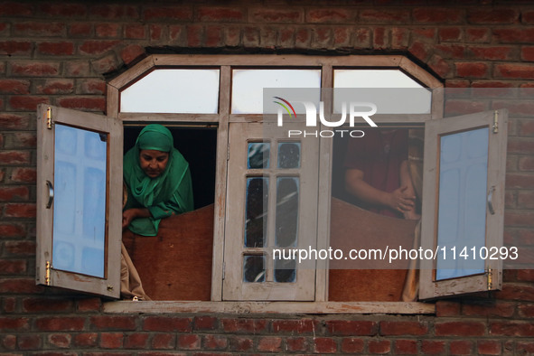 Kashmiri Muslims are watching a Muharram procession on the eighth day of Ashura in Srinagar, Jammu and Kashmir, on July 15, 2024. The state...