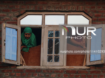 Kashmiri Muslims are watching a Muharram procession on the eighth day of Ashura in Srinagar, Jammu and Kashmir, on July 15, 2024. The state...