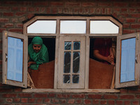 Kashmiri Muslims are watching a Muharram procession on the eighth day of Ashura in Srinagar, Jammu and Kashmir, on July 15, 2024. The state...