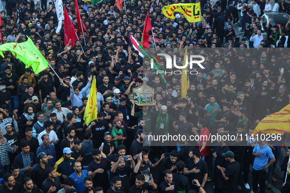 Kashmiri Shiite Muslim mourners are taking part in a Muharram procession on the eighth day of Ashura in Srinagar, Jammu and Kashmir, on July...