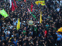 Kashmiri Shiite Muslim mourners are taking part in a Muharram procession on the eighth day of Ashura in Srinagar, Jammu and Kashmir, on July...