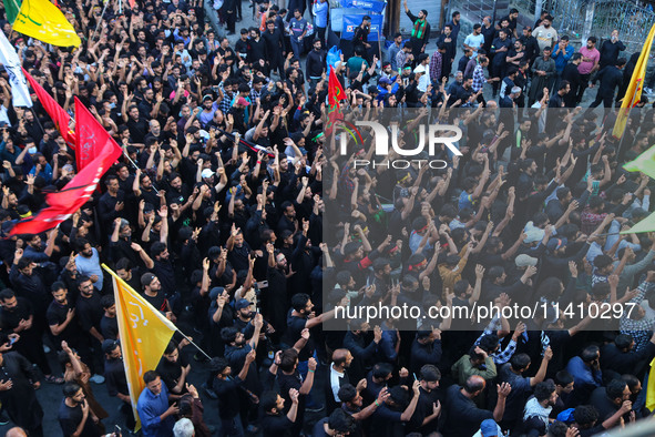 Kashmiri Shiite Muslim mourners are taking part in a Muharram procession on the eighth day of Ashura in Srinagar, Jammu and Kashmir, on July...