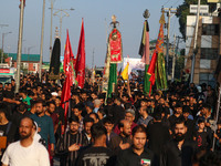 Kashmiri Shiite Muslim mourners are taking part in a Muharram procession on the eighth day of Ashura in Srinagar, Jammu and Kashmir, on July...