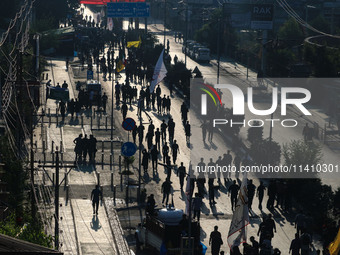 Kashmiri Shiite Muslim mourners are taking part in a Muharram procession on the eighth day of Ashura in Srinagar, Jammu and Kashmir, on July...