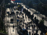 Kashmiri Shiite Muslim mourners are taking part in a Muharram procession on the eighth day of Ashura in Srinagar, Jammu and Kashmir, on July...