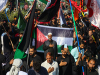 Kashmiri Shiite Muslim mourners are taking part in a Muharram procession on the eighth day of Ashura in Srinagar, Jammu and Kashmir, on July...