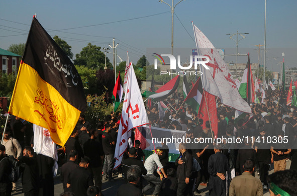 Kashmiri Shiite Muslim mourners are taking part in a Muharram procession on the eighth day of Ashura in Srinagar, Jammu and Kashmir, on July...