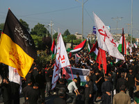 Kashmiri Shiite Muslim mourners are taking part in a Muharram procession on the eighth day of Ashura in Srinagar, Jammu and Kashmir, on July...