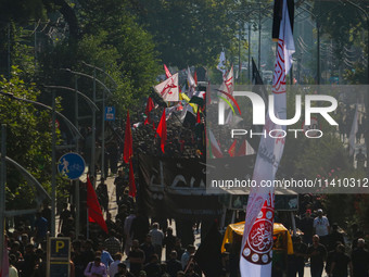 Kashmiri Shiite Muslim mourners are taking part in a Muharram procession on the eighth day of Ashura in Srinagar, Jammu and Kashmir, on July...