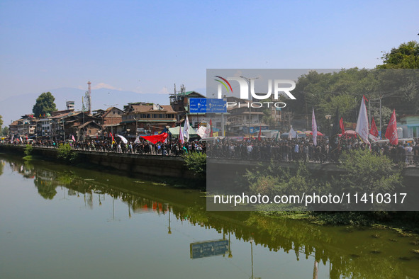 Kashmiri Shiite Muslim mourners are taking part in a Muharram procession on the eighth day of Ashura in Srinagar, Jammu and Kashmir, on July...