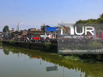 Kashmiri Shiite Muslim mourners are taking part in a Muharram procession on the eighth day of Ashura in Srinagar, Jammu and Kashmir, on July...