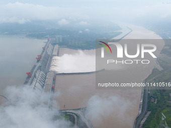 Nine holes are opening to release flood water from the Three Gorges Reservoir in Yichang, Hubei province, China, on July 14, 2024. (