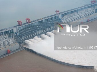 Nine holes are opening to release flood water from the Three Gorges Reservoir in Yichang, Hubei province, China, on July 14, 2024. (