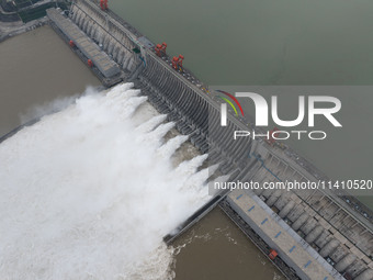 Nine holes are opening to release flood water from the Three Gorges Reservoir in Yichang, Hubei province, China, on July 14, 2024. (