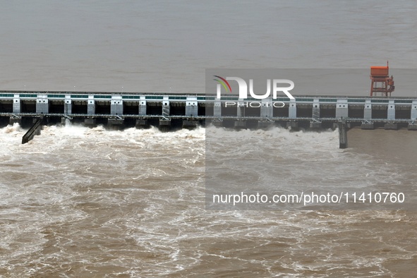 The Gezhouba Dam Water Conservancy Key project of the Yangtze River is opening to release floodwater in Yichang, Hubei province, China, on J...