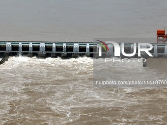 The Gezhouba Dam Water Conservancy Key project of the Yangtze River is opening to release floodwater in Yichang, Hubei province, China, on J...