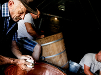 Baca Krzysztof Las (a traditional Polish Carpathian mountains shepherd), his son Piotr and his helper Wojtek make sheep cheese, Oscypek, in...