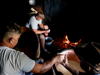 Baca Krzysztof Las (a traditional Polish Carpathian mountains shepherd), his son Piotr and his helper Wojtek make sheep cheese, Oscypek, in...