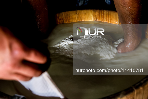 Baca Krzysztof Las (a traditional Polish Carpathian mountains shepherd) prepares sheep milk to make cheese in Traditional wooden shepherd ho...