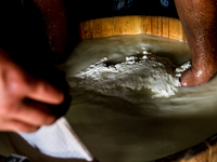 Baca Krzysztof Las (a traditional Polish Carpathian mountains shepherd) prepares sheep milk to make cheese in Traditional wooden shepherd ho...