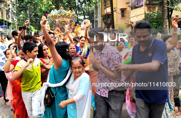 Devotees are taking part in a procession of Ulto Rath Yatra (Return Chariot Procession) in Siliguri, India, on July 15, 2024. 