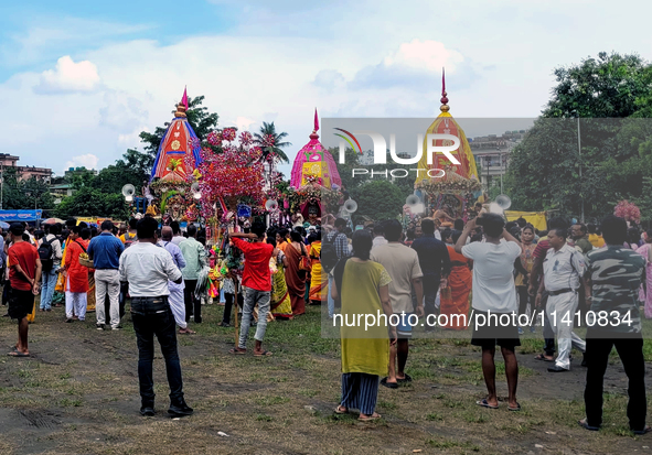 Devotees are taking part in a procession of Ulto Rath Yatra (Return Chariot Procession) in Siliguri, India, on July 15, 2024. 