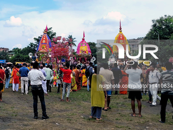 Devotees are taking part in a procession of Ulto Rath Yatra (Return Chariot Procession) in Siliguri, India, on July 15, 2024. (