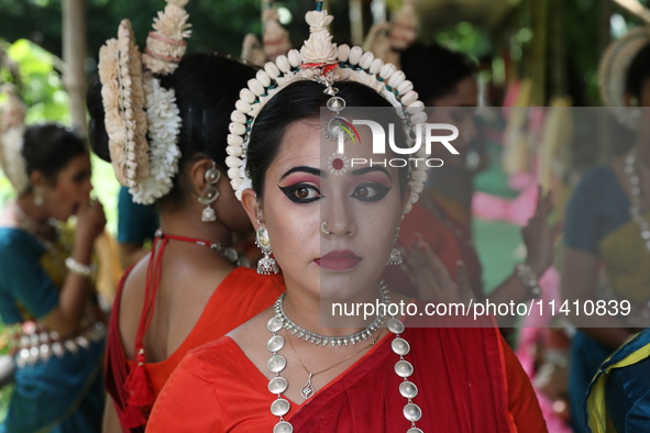 An artist is waiting to perform on the last day of the week-long celebration of Rath Yatra, or chariot procession, in Kolkata, India, on Jul...