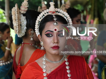 An artist is waiting to perform on the last day of the week-long celebration of Rath Yatra, or chariot procession, in Kolkata, India, on Jul...