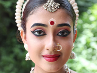 An artist is posing for a picture as she is waiting to perform on the last day of the week-long celebration of Rath Yatra, or chariot proces...