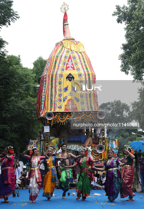 Artists are performing on the last day of the week-long celebration of Rath Yatra, or chariot procession, in Kolkata, India, on July 15, 202...