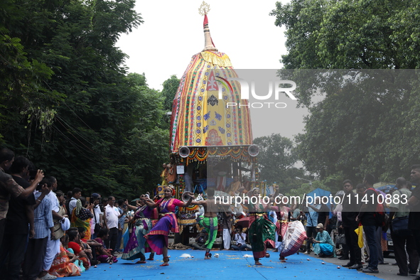 Artists are performing on the last day of the week-long celebration of Rath Yatra, or chariot procession, in Kolkata, India, on July 15, 202...