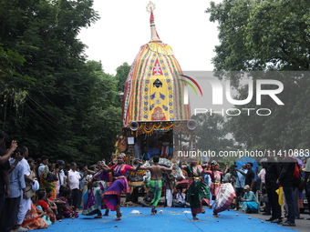 Artists are performing on the last day of the week-long celebration of Rath Yatra, or chariot procession, in Kolkata, India, on July 15, 202...