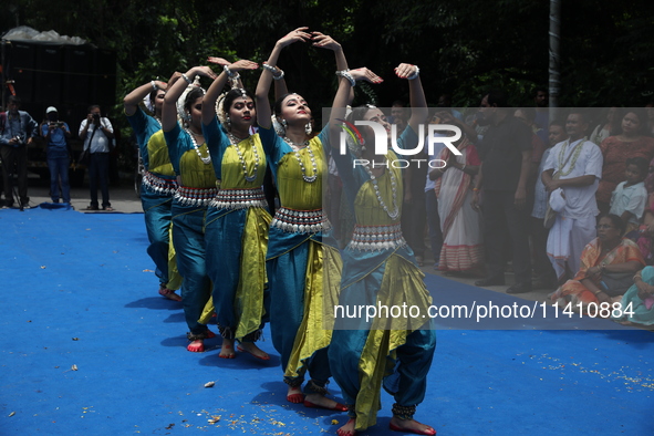 Artists are performing on the last day of the week-long celebration of Rath Yatra, or chariot procession, in Kolkata, India, on July 15, 202...