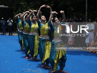 Artists are performing on the last day of the week-long celebration of Rath Yatra, or chariot procession, in Kolkata, India, on July 15, 202...