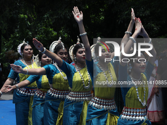 Artists are performing on the last day of the week-long celebration of Rath Yatra, or chariot procession, in Kolkata, India, on July 15, 202...