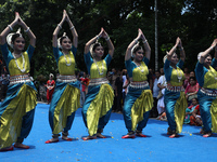 Artists are performing on the last day of the week-long celebration of Rath Yatra, or chariot procession, in Kolkata, India, on July 15, 202...