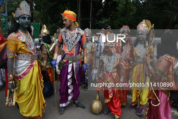 Artists are dressing as Hindu God and Goddess as they are waiting to perform on the last day of the week-long celebration of Lord Jagannath'...