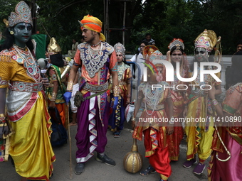 Artists are dressing as Hindu God and Goddess as they are waiting to perform on the last day of the week-long celebration of Lord Jagannath'...