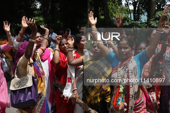 Hindu devotees are raising their hands and shouting religious slogans on the last day of the week-long celebration of Rath Yatra, or chariot...