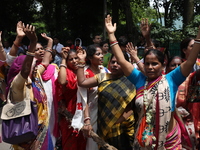 Hindu devotees are raising their hands and shouting religious slogans on the last day of the week-long celebration of Rath Yatra, or chariot...