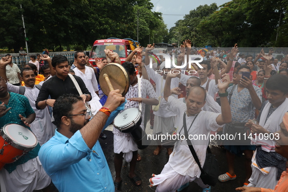 Hindu devotees are dancing and singing religious songs on the last day of the week-long celebration of Rath Yatra, or chariot procession, in...