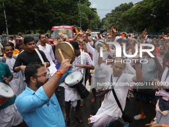 Hindu devotees are dancing and singing religious songs on the last day of the week-long celebration of Rath Yatra, or chariot procession, in...