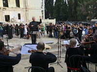 Conductor Herman Makarenko is directing the musicians of the Kyiv Classic Orchestra during the requiem for the victims of the Russian missil...