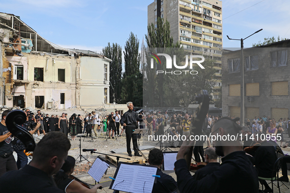 Conductor Herman Makarenko is directing the musicians of the Kyiv Classic Orchestra during the requiem for the victims of the Russian missil...