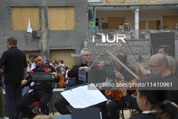 Musicians of the Kyiv Classic Orchestra are performing during the requiem for the victims of the Russian missile attack on the Ohmatdyt Nati...