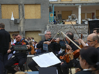 Musicians of the Kyiv Classic Orchestra are performing during the requiem for the victims of the Russian missile attack on the Ohmatdyt Nati...