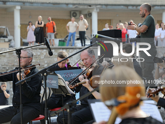 Musicians of the Kyiv Classic Orchestra are performing during the requiem for the victims of the Russian missile attack on the Ohmatdyt Nati...