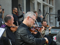 Musicians of the Kyiv Classic Orchestra are performing during the requiem for the victims of the Russian missile attack on the Ohmatdyt Nati...