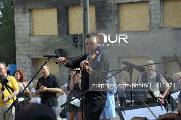 Musicians of the Kyiv Classic Orchestra are performing during the requiem for the victims of the Russian missile attack on the Ohmatdyt Nati...